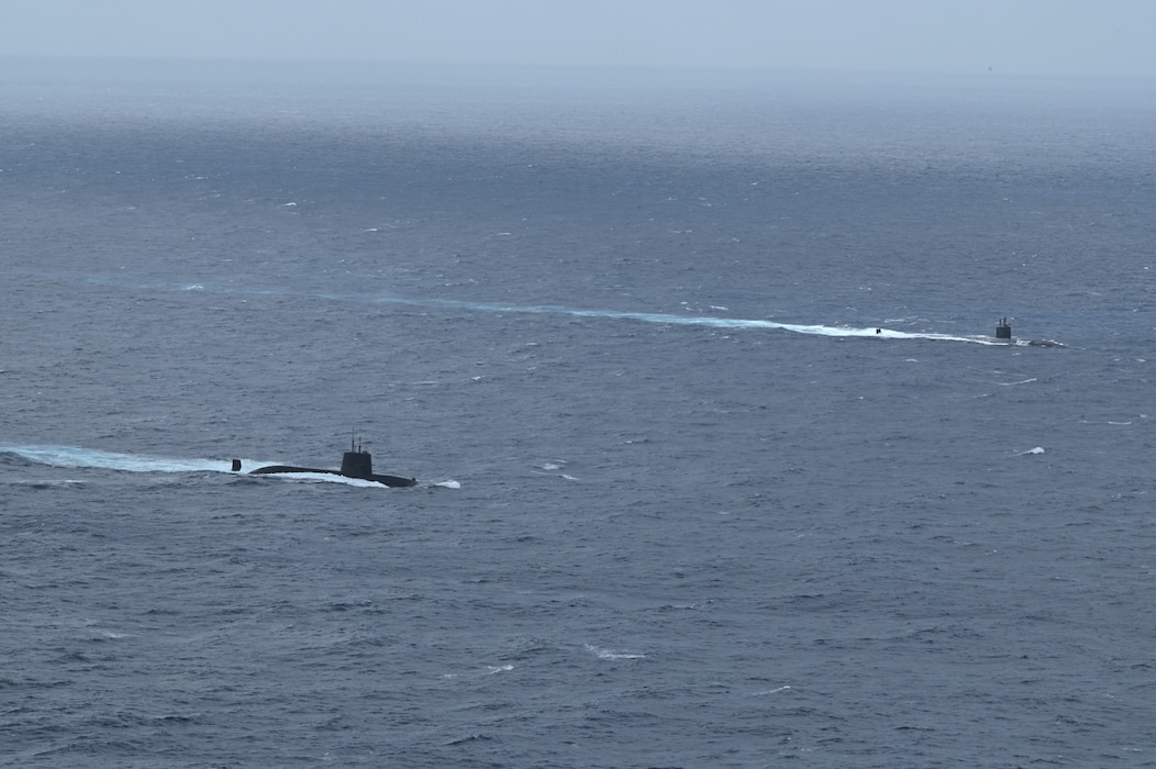 The Los Angeles-class fast-attack submarine USS Santa Fe (SSN 763) and a Japan Maritime Self-Defense Force (JMSDF) submarine steam alongside one another during Submarine Exercise (SUBEX) 25-1 in the Pacific Ocean, July 12, 2025.