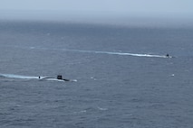 The Los Angeles-class fast-attack submarine USS Santa Fe (SSN 763) and a Japan Maritime Self-Defense Force (JMSDF) submarine steam alongside one another during Submarine Exercise (SUBEX) 25-1 in the Pacific Ocean, July 12, 2025.