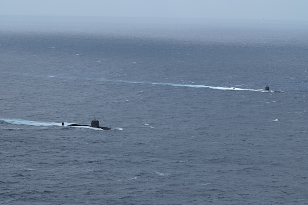 The Los Angeles-class fast-attack submarine USS Santa Fe (SSN 763) and a Japan Maritime Self-Defense Force (JMSDF) submarine steam alongside one another during Submarine Exercise (SUBEX) 25-1 in the Pacific Ocean, July 12, 2025.