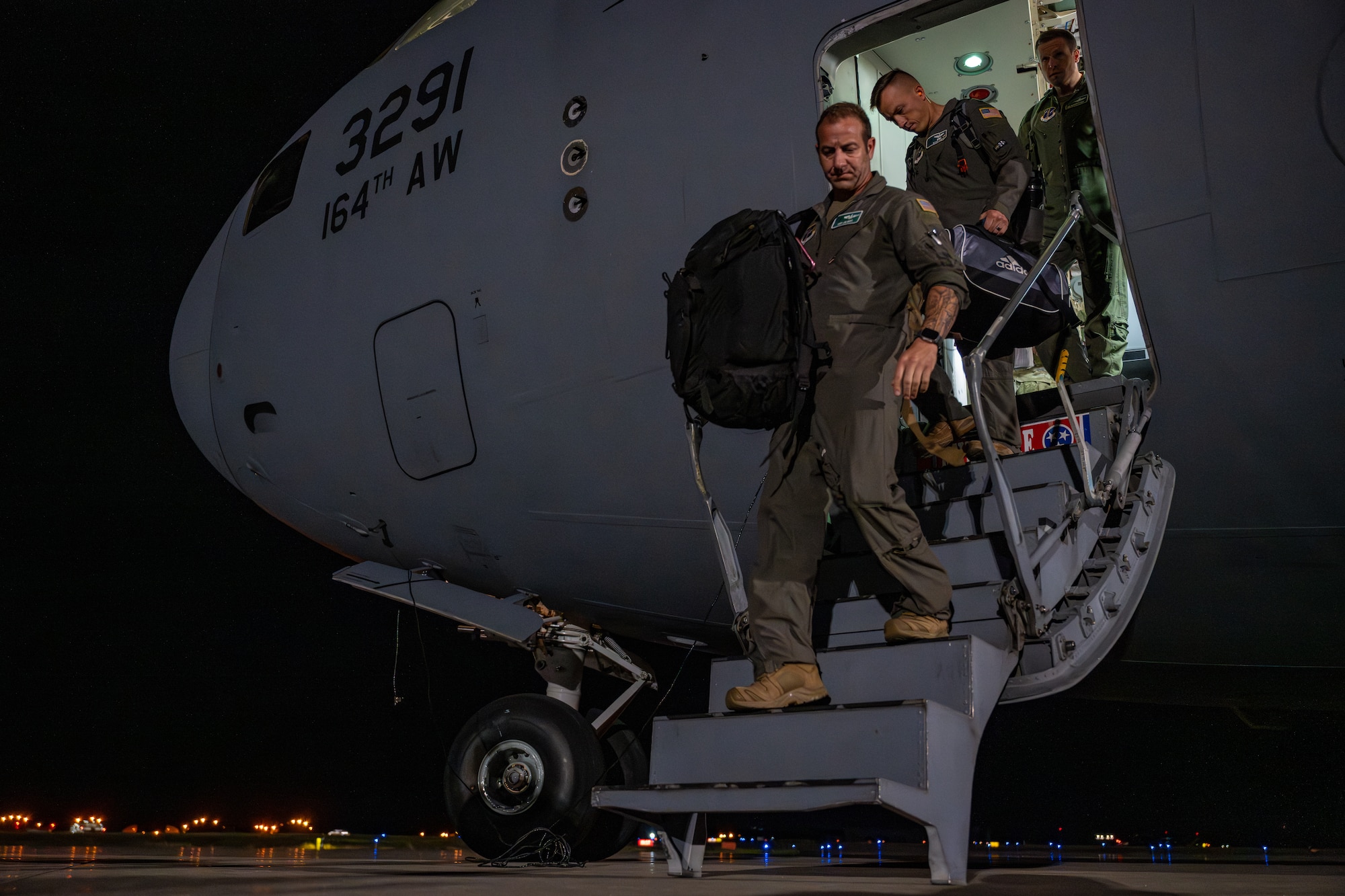U.S. Airmen assigned to the 106th Rescue Wing disembark from a C-17 Globemaster III aircraft ahead of their support for exercise Resolute Force Pacific (REFORPAC) 2025 at Misawa Air Base, Japan, July 11, 2025. REFORPAC is part of the first-in-a-generation Department-Level Exercise series, employing more than 400 Joint and coalition aircraft and more than 12,000 members at more than 50 locations across 3,000 miles. (U.S. Air Force photo by Airman 1st Class Andre Medina)