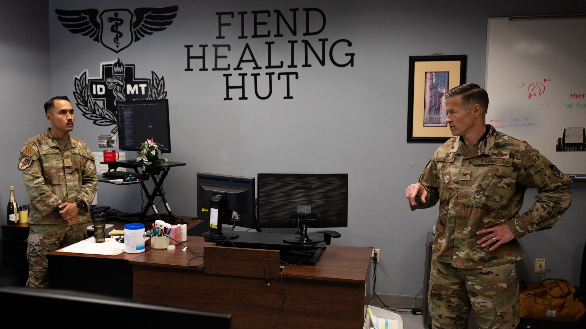U.S. Air Force Col. Ryan Ley, right, 51st Fighter Wing commander, speaks with Staff Sgt. Norbu Tsering, left, 36th Fighter Squadron independent duty medical technician, at Osan Air Base, Republic of Korea, July 15, 2025. Ley’s immersion with the 36th FS offered him valuable insight on how IDMTs support medical care and operational readiness, helping ensure personnel are mission-ready. (U.S. Air Force photo by Senior Airman Rome Bowermaster) (This photo has been edited for security measures)