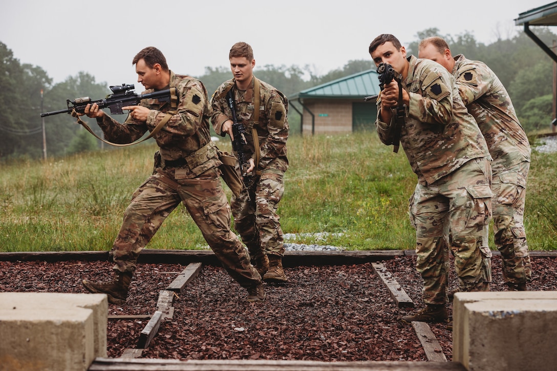 Soldiers with Bravo Company, 1st Battalion, 112th Infantry Regiment, 56th Stryker Brigade Combat Team practice various close quarter battle techniques at the live fire shoot house complex at Fort Indiantown Gap, Pennsylvania, June 10, 2025. The Soldiers conducted several iterations to practice movement while firing live rounds. (U.S. Army National Guard photo by Staff Sgt. Jonathan Campbell)