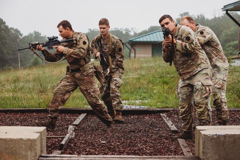 Soldiers with Bravo Company, 1st Battalion, 112th Infantry Regiment, 56th Stryker Brigade Combat Team practice various close quarter battle techniques at the live fire shoot house complex at Fort Indiantown Gap, Pennsylvania, June 10, 2025. The Soldiers conducted several iterations to practice movement while firing live rounds. (U.S. Army National Guard photo by Staff Sgt. Jonathan Campbell)