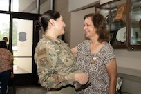 Anita Conder looks at Tech. Sgt Karina Barajas of the Inter-American Air Forces Academy, after her retirement ceremony.