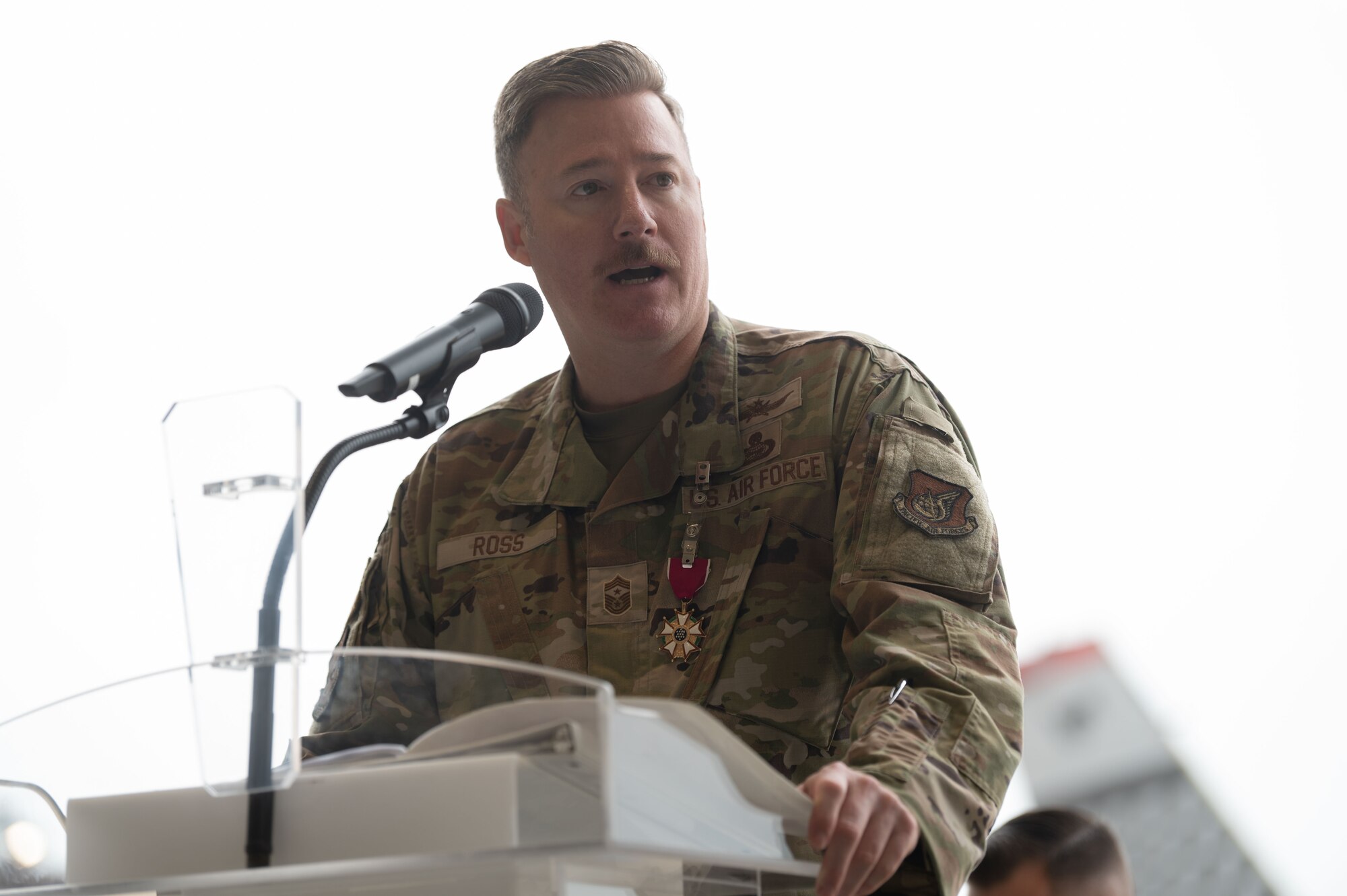 Chief Master Sgt. Jeremiah Ross, outgoing command chief master sergeant for Seventh Air Force, delivers his farewell remarks during a Change of Responsibility ceremony at Osan Air Base, Republic of Korea, July 17, 2025. In his role, Ross served as the advisor to the commander on matters regarding the welfare, readiness, morale, and proper utilization of Airmen across the Korean Peninsula, ensuring the combat readiness of the U.S.-ROK Alliance. (U.S. Air Force photo by Staff Sgt. Dustin Braaten)