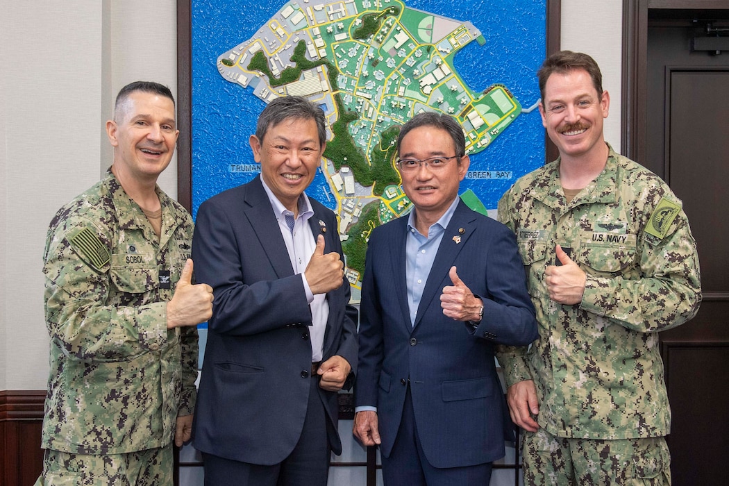From the left, Capt. Les Sobol, Commander, Fleet Activities Yokosuka (CFAY), Masamichi Katoh, Yokosuka city council chairman, Hironobu Tsuchida, Yokosuka city council vice chairman, and Cmdr. Patrick Gutierrez, CFAY Chief Staff Officer, pose for a photo during an office call at CFAY headquarters.