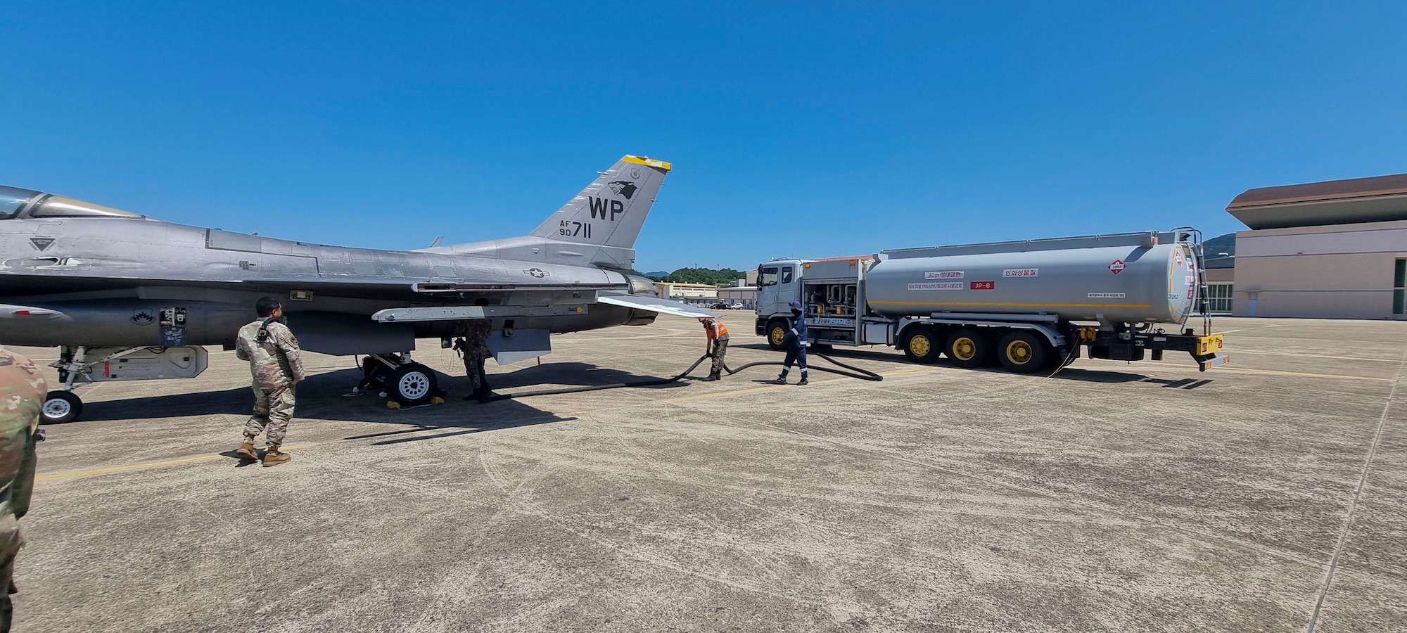 Members of the Republic of Korea Air Force refuel a U.S. Air Force F-16 Fighting Falcon aircraft during a cross-servicing interoperability event between the U.S. Air Force and ROKAF at Daegu Air Base, Republic of Korea, June 11, 2025. Col. Kathryn “Wolf” Gaetke, 8th FW commander, led a flight of two F-16 Fighting Falcon aircraft to DAB where ROKAF maintainers from the 38th Fighter Group received and serviced the aircraft. (U.S. Air Force courtesy photo.)
