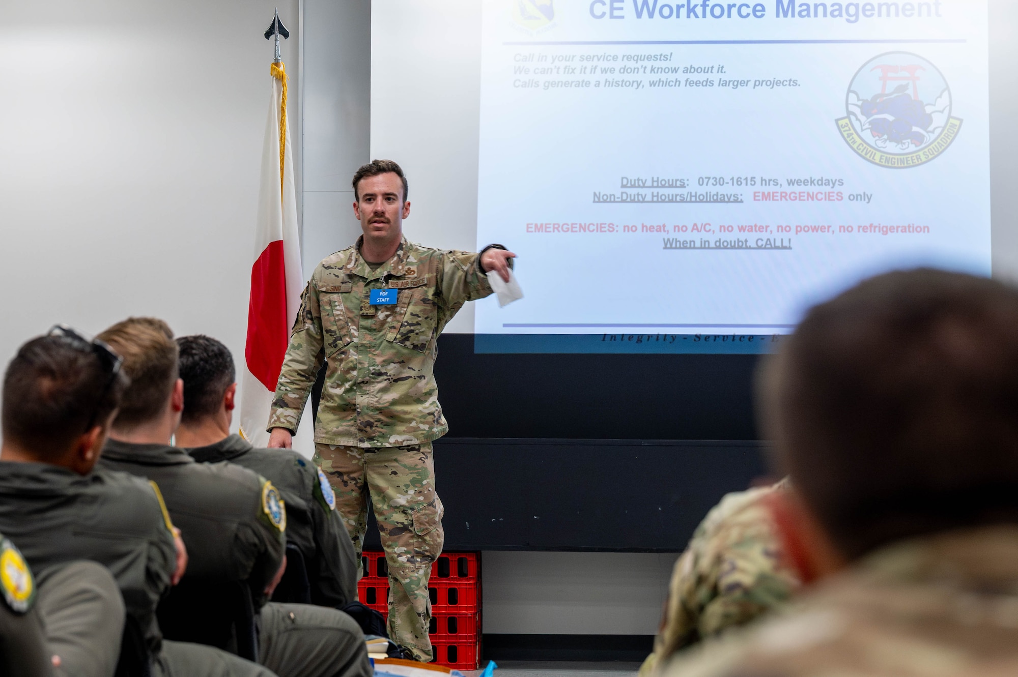 A military member briefs deployed military members.
