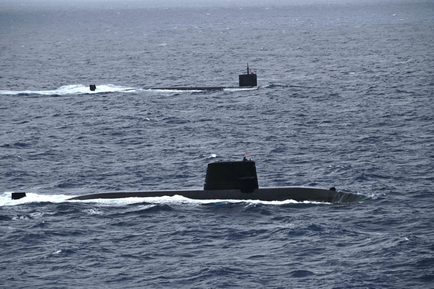 PACIFIC OCEAN (July 12, 2025) – The Los Angeles-class fast-attack submarine USS Santa Fe (SSN 763) and a Japan Maritime Self-Defense Force (JMSDF) submarine steam alongside one another during Submarine Exercise (SUBEX) 25-1, in the Pacific Ocean, July 12, 2025. SUBEX 25-1 was a two-day exercise between the U.S. Navy and JMSDF in the vicinity of Yokosuka to advance joint submarine capabilities and operations. CSG 7 directs forward-deployed, combat capable forces across the full spectrum of undersea warfare throughout the Western Pacific, Indian Ocean, and Arabian Sea. (Photo courtesy of JMSDF.)