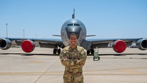 Senior Airman Gabriel Bautista, 93rd Expeditionary Aerial Refueling Squadron boom operator, poses for a portrait in front of a KC-135 Stratotanker.