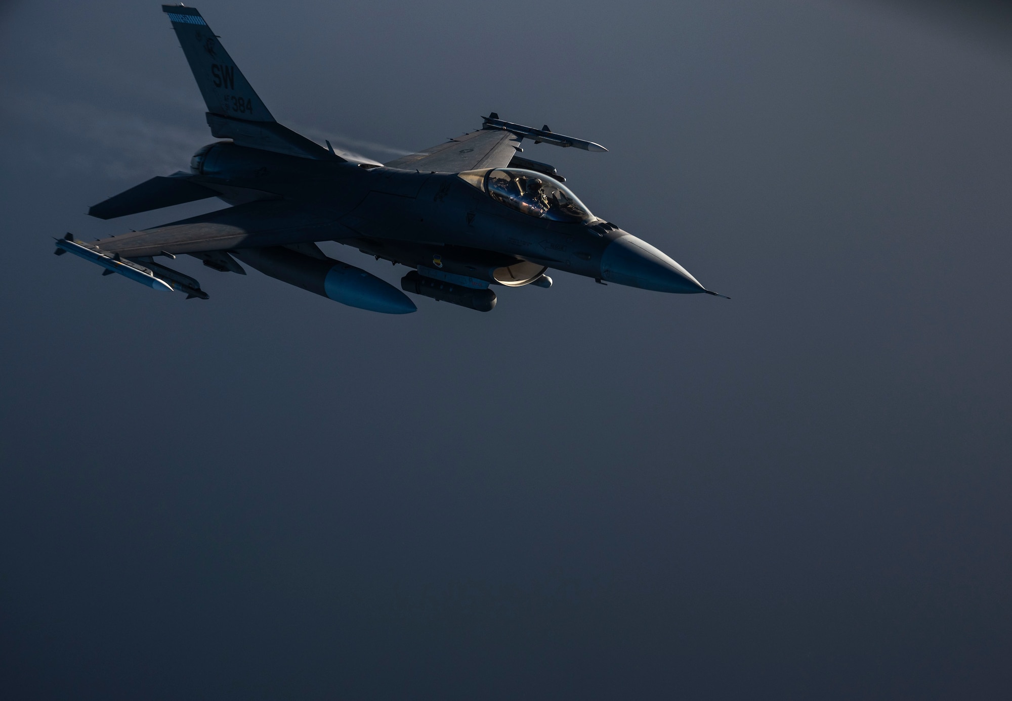 A U.S. Air Force F-16 Fighting Falcon departs after being refueled.