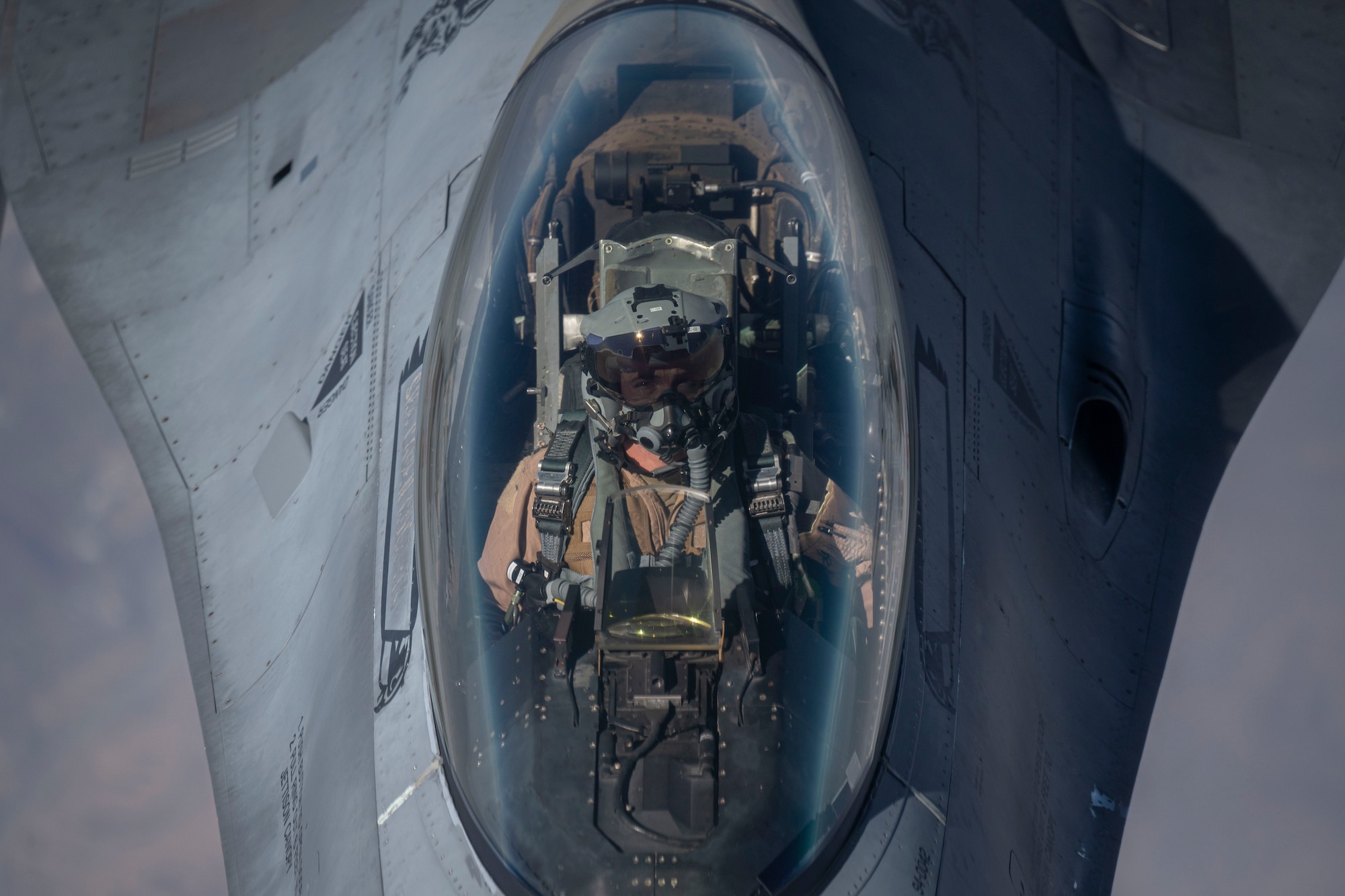 A pilot approaches a boom.