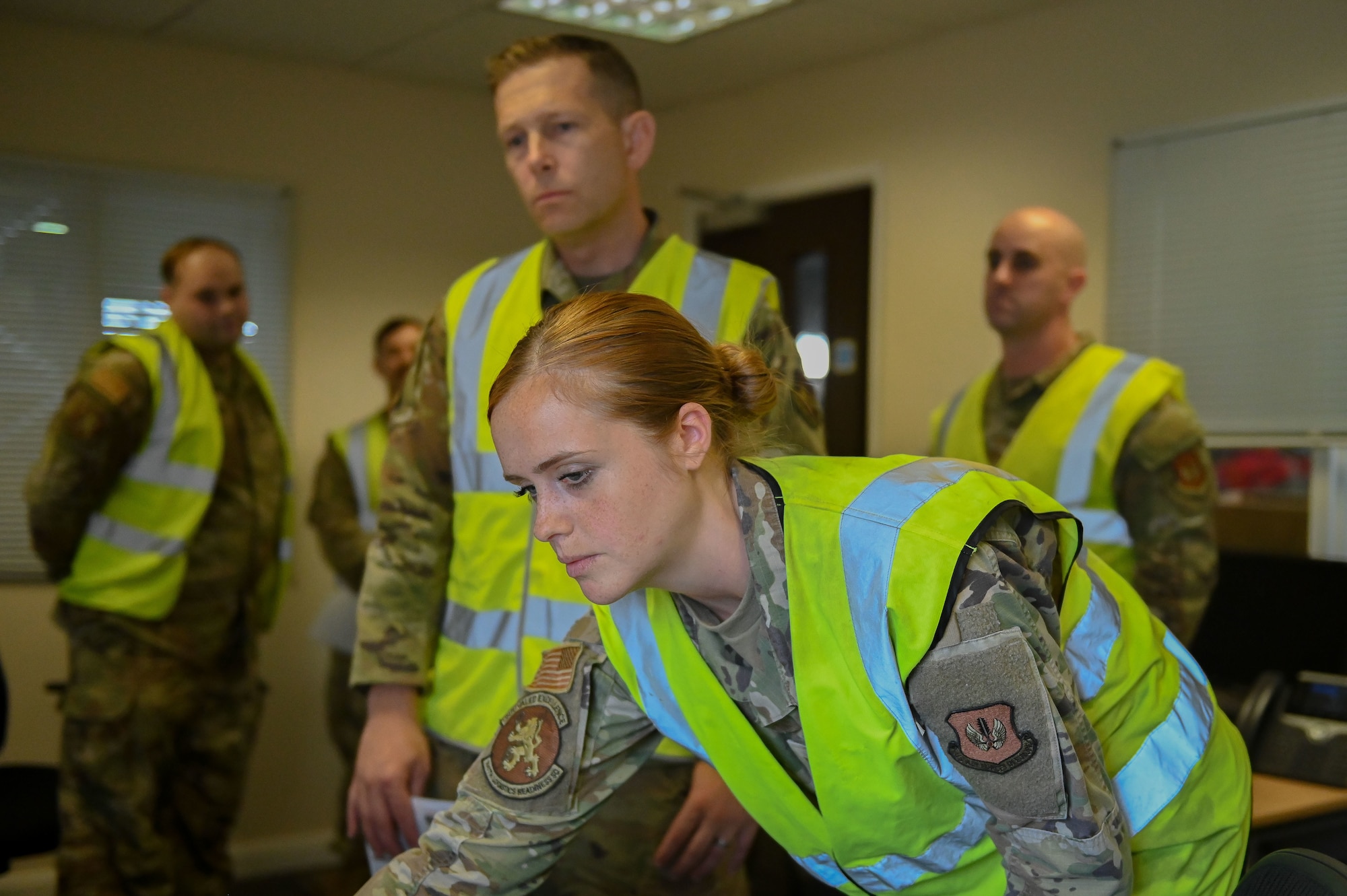U.S. Air Force Staff Sgt. Ryanna Hopper Catugy, 100th Logistics Readiness Squadron noncommissioned officer in charge of inbound cargo, briefs Col. Jonathan O’Dell, 100 Air Refueling Wing deputy commander, during a cargo development function walk through at RAF Mildenhall, England, July 15, 2025.