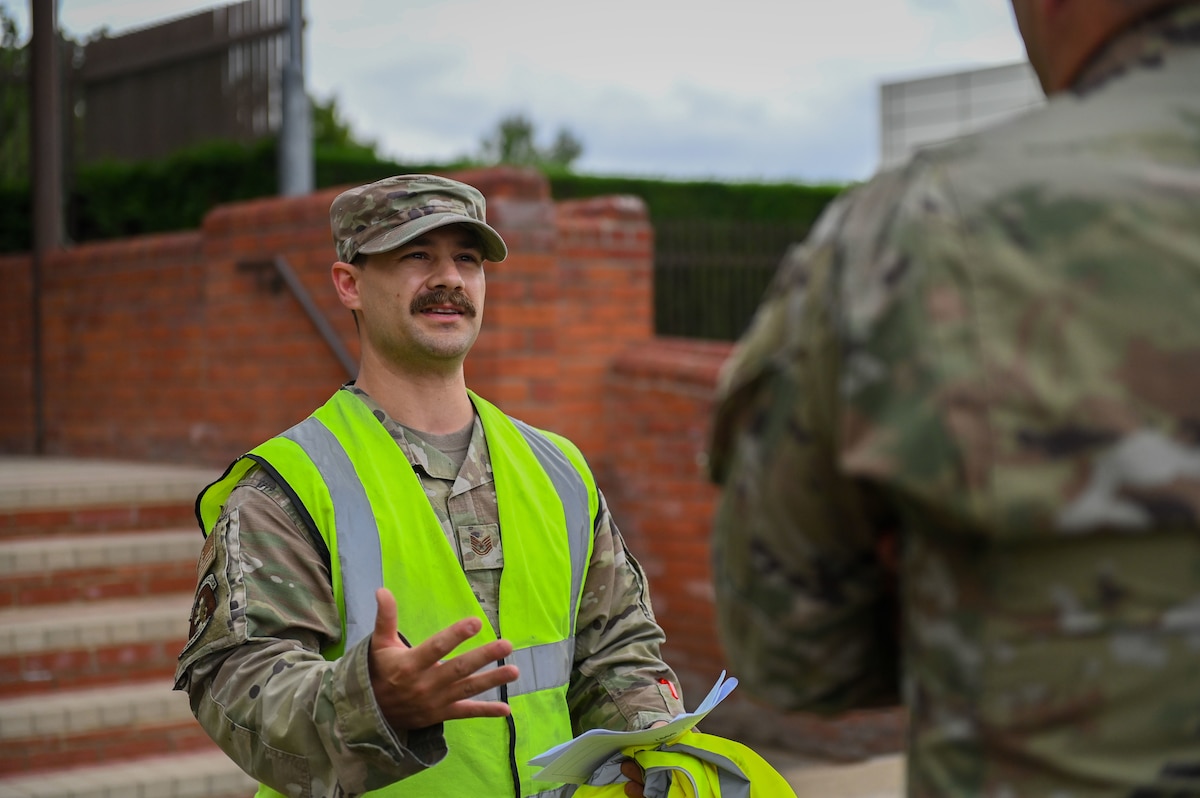 U.S. Air Force Tech. Sgt. Lucas Wiemer, 100th Logistics Readiness Squadron air transportation functions section chief, gives a brief during a cargo deployment function walk through during the 100th Air Refueling Wing command team “Day in the Life” integration at RAF Mildenhall, England, July 15, 2025.