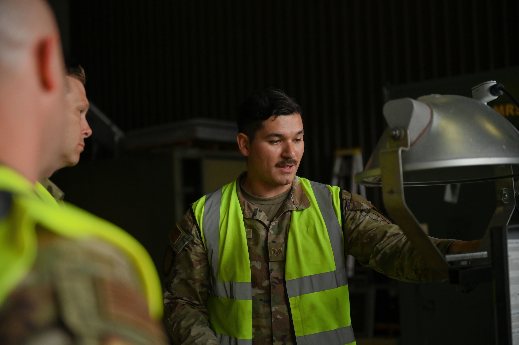 U.S. Air Force Staff Sgt. Elias Hernandez, 100th Aircraft Maintenance Squadron flightline crew chief, briefs his leadership for a cargo development function walk through at RAF Mildenall, England, July 15, 2025.