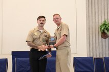 Vice Adm. Johnny Wolfe Jr. (right), Director, Strategic Systems Programs (DIRSSP), presents the DIRSSP Shore Sailor of the Year Award to Master-At-Arms First Class Tyler Cassidy (left), Marine Corps Security Force Battalion Kings Bay, during a celebratory event hosted by Strategic Weapons Facility, Atlantic (SWFLANT) at the Naval Submarine Base Kings Bay, Ga. chapel on July 3, in honor of the 70th anniversary of Strategic Systems Programs (SSP). Marine Corps Security Force Battalion Kings Bay secures strategic assets within SWFLANT’s area of responsibility in order to prevent unauthorized access or loss of control.
