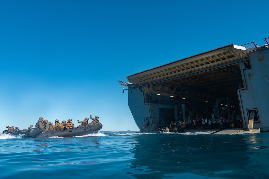 U.S. Marines with 31st Marine Expeditionary Unit recover aboard the amphibious transport dock USS San Diego (LPD 22), during a shore-to-ship movement, utilizing the Enhanced Combat Rubber Reconnaissance Craft as a part of exercise Talisman Sabre 25, in the Coral Sea, July 14, 2025. Marines conducted the shore-to-ship movement to improve amphibious raid capabilities and sustain small boat skills. Talisman Sabre is the largest bilateral military exercise between Australia and the United States advancing a free and open Indo-Pacific by strengthening relationships and interoperability among key allies and partners, while enhancing our collective capabilities to respond to a wide array of potential security concerns. (U.S. Marine Corps photo by Lance Cpl. Trevor BishopWilliams)