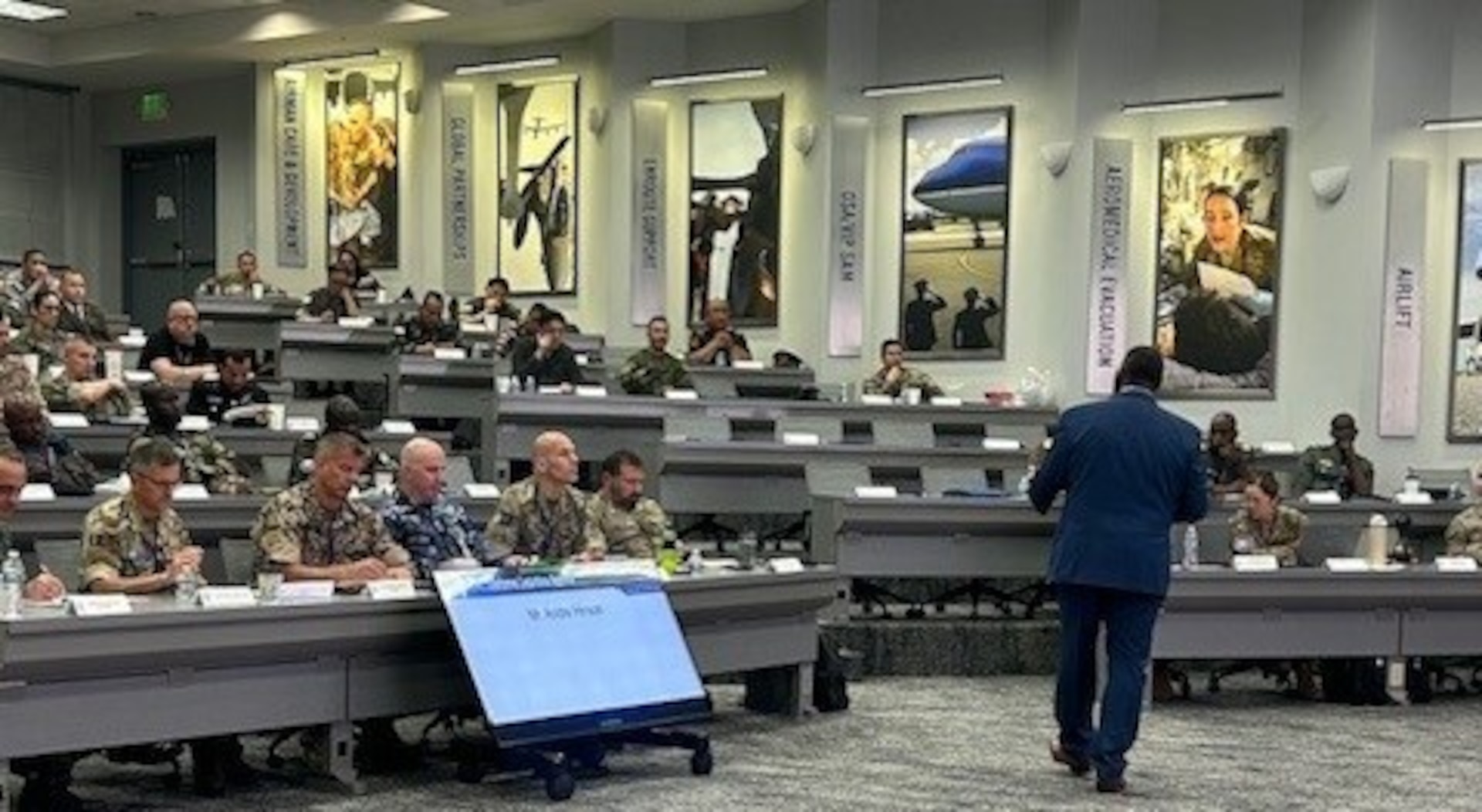 The Defense Logistics Agency’s Account Manager for Foreign Military Sales and Security Cooperation and liaison to the Defense Security Cooperation Agency Andre Hinson briefs future military logistics officers of U.S. allies and partner nations during the U.S. Transportation Command International Logistics Symposium at Scott Air Force Base, Illinois