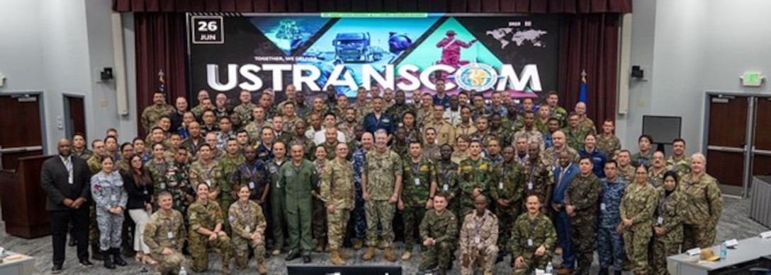 More than 120 attendees from 60 countries pose for a photo during a breakout session at the U.S. Transportation Command International Logistics Symposium at Scott Air Force Base, Illinois