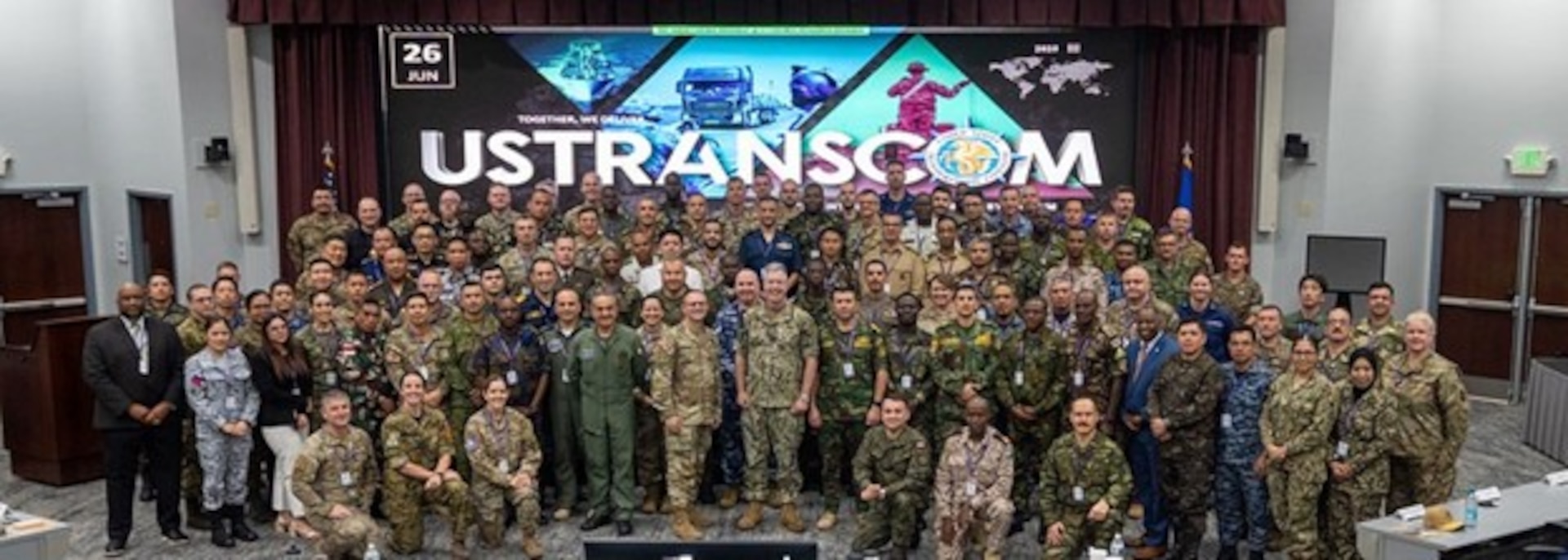 More than 120 attendees from 60 countries pose for a photo during a breakout session at the U.S. Transportation Command International Logistics Symposium at Scott Air Force Base, Illinois