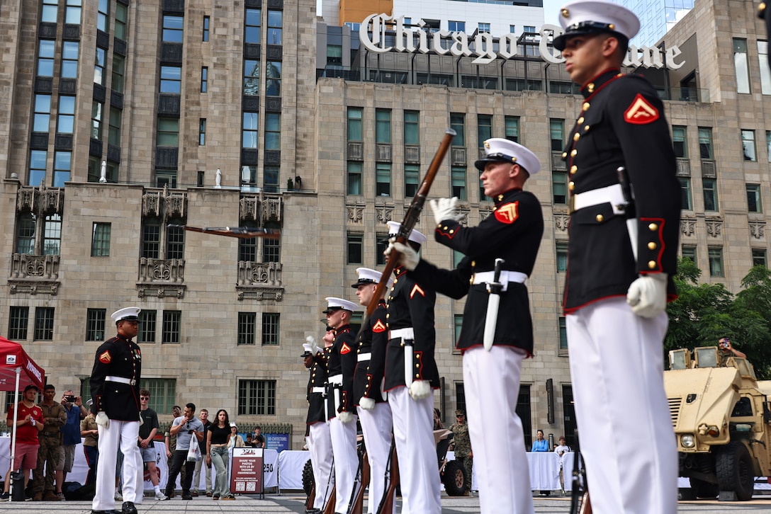 U.S. Marines with the United States Marine Corps Silent Drill Platoon execute their "double inspection" sequence as a part of a public performance in Chicago, July 11, 2025. Throughout the year, Marines across the globe celebrate the 250th birthday of the Corps, commemorating service, sacrifice, and priding themselves on living ‘Semper Fidelis’ or ‘Always Faithful’ to their nation and to each other.