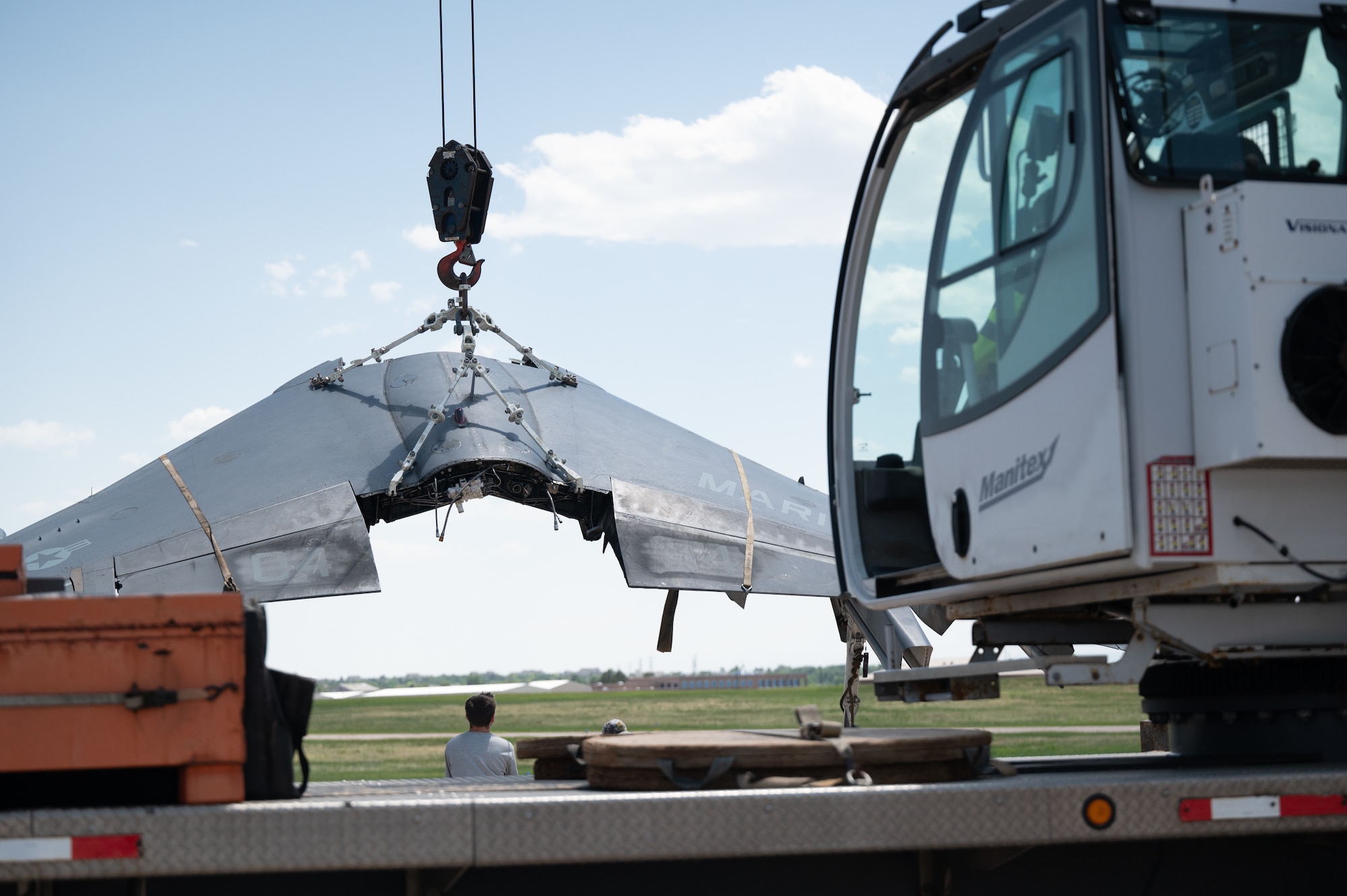 wing plane gets loaded onto truck