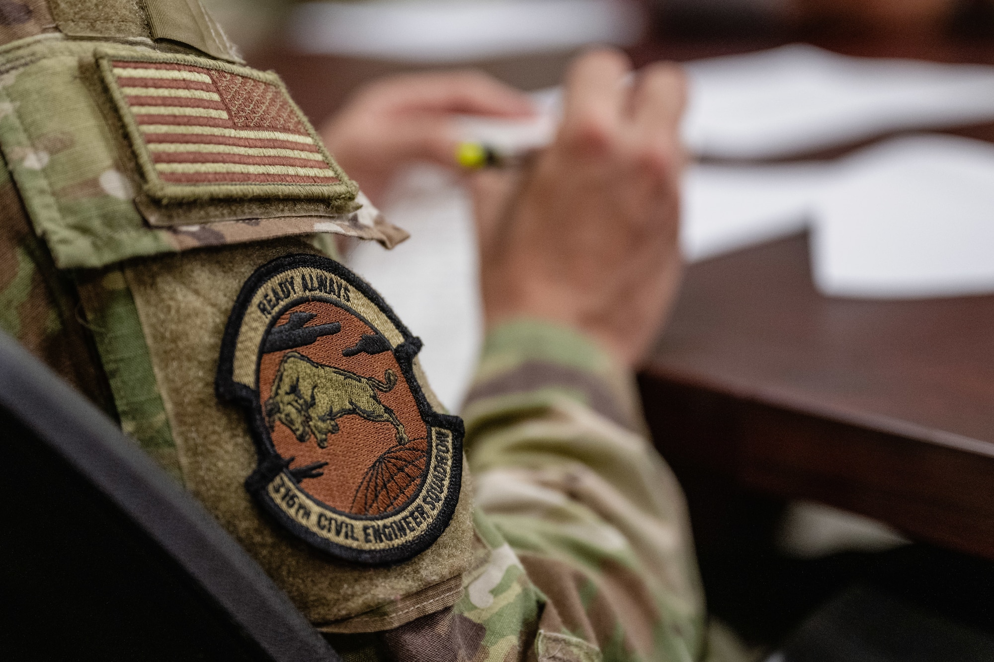 The 316th Civil Engineer Squadron Prime Base Engineer Emergency Force Olympics leads hold a meeting.
