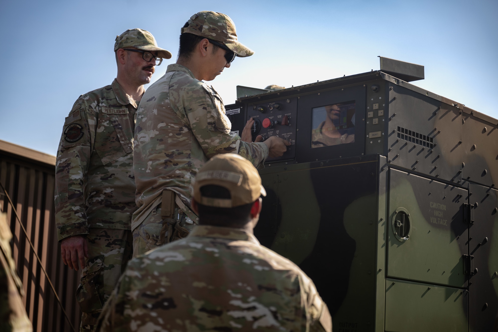 U.S. Airmen assigned to the 316th Civil Engineer Squadron, work together to repair an inoperable generator.