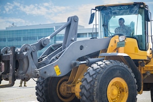 Senior Airman Kervee Mendoza, operates a 10K all-terrain forklift.