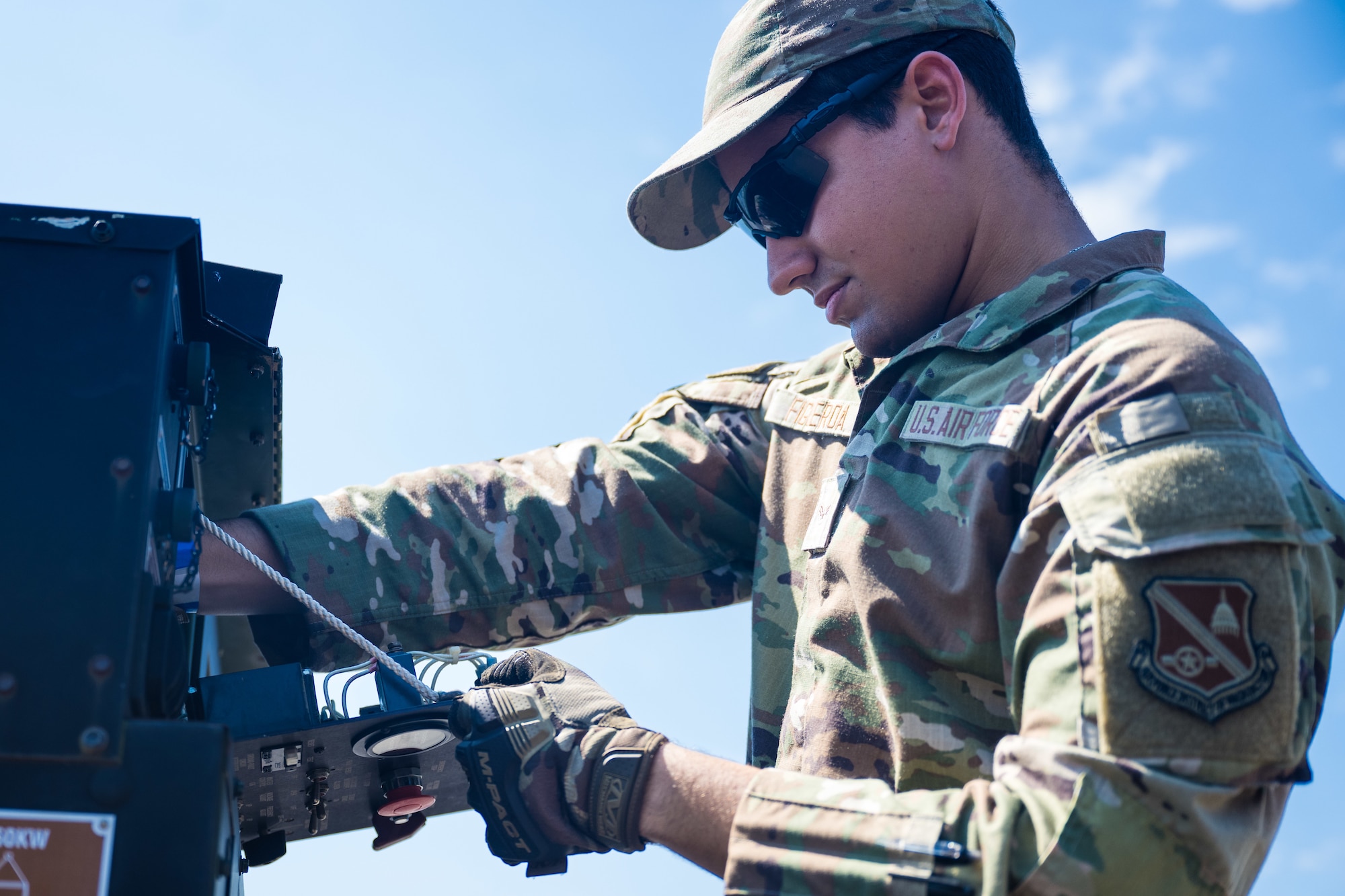 Airman 1st Class Bryan Figueroa, works on a generator.