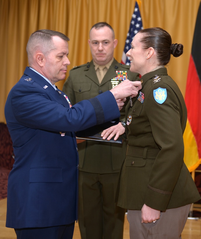 Maj. Gen. David Sanford places the Defense Superior Service Medal on Col. Adrian J. Sullivan