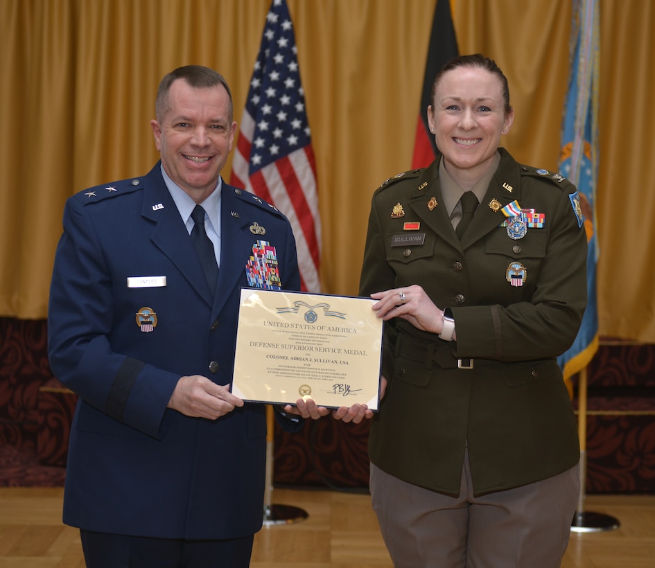 Maj. Gen. David Sanford and Col. Adrian J. Sullivan pose with a certificate between them