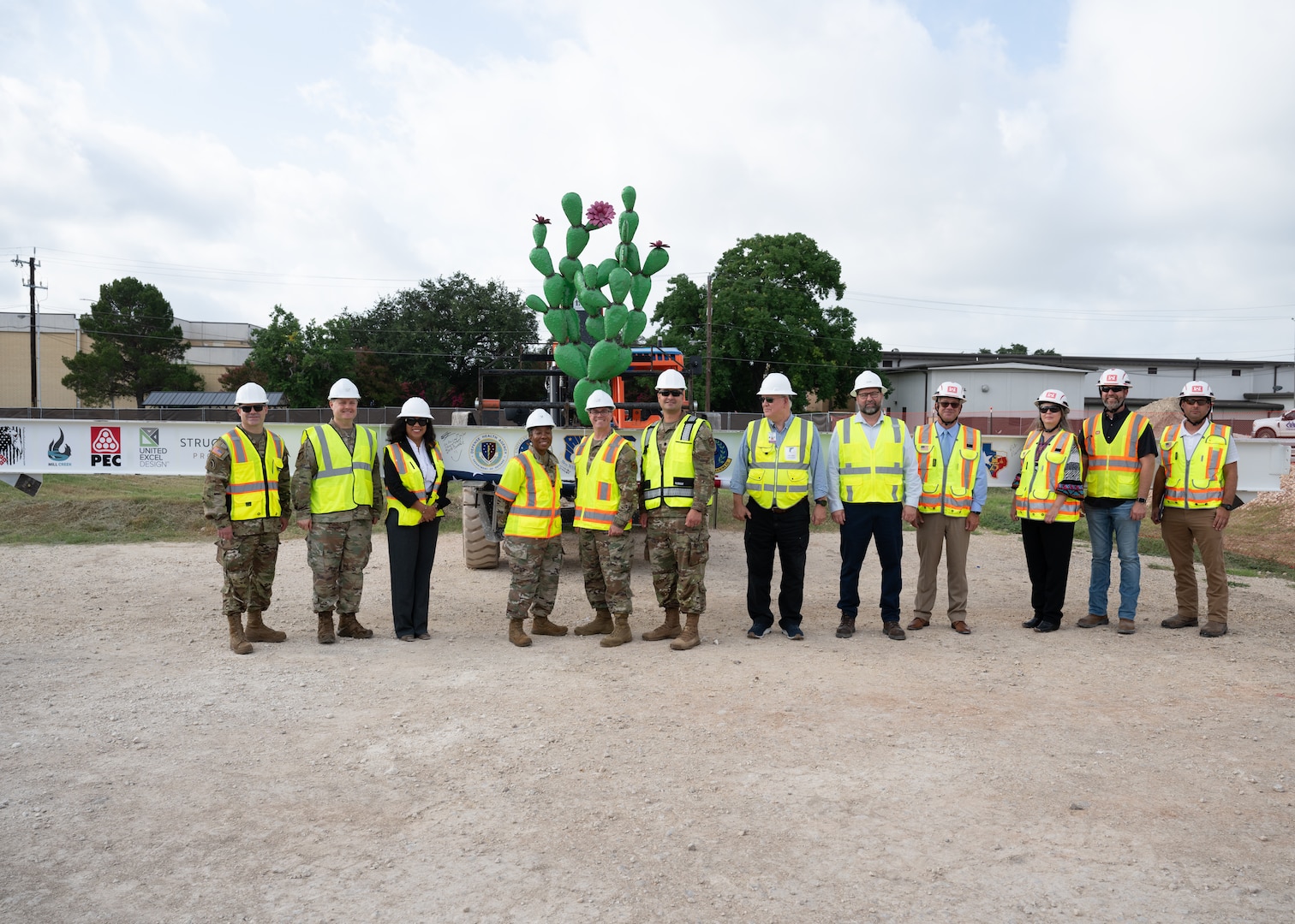 Military and civilian leaders pose for a group photo during the Dunn Dental Clinic topping-out ceremony at Joint Base San Antonio-Lackland, Texas, July 16, 2025.
