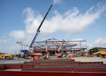 Contractors raise the final steel beam into place at the future Dunn Dental Clinic during a topping-out ceremony at Joint Base San Antonio-Lackland, Texas, July 16, 2025.