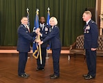 16th Air Force commander passes unit guidon to new 688th CW commander.