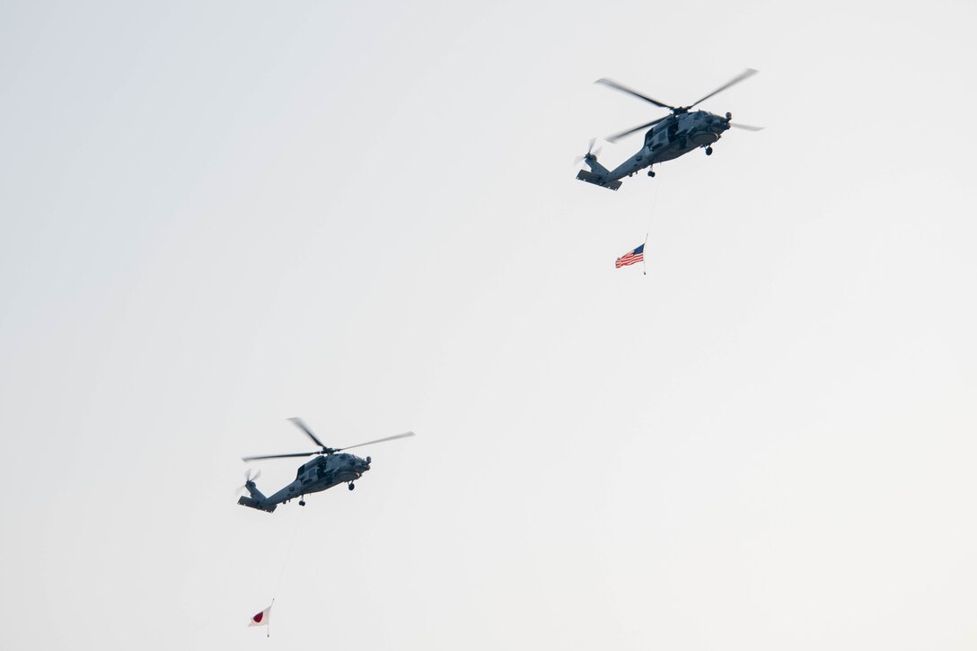 Helicopters with US and Japan flags fly over NAF Atsugi's Bon Odori Festival.