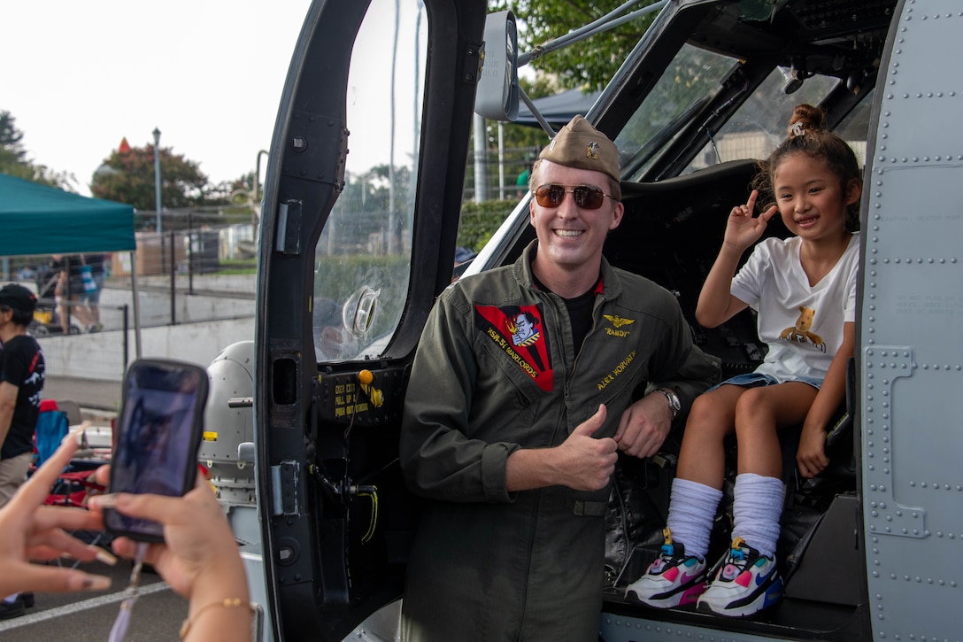 Sailor pose for a photo onboard NAF Atsugi during the Bon Odori Festival.