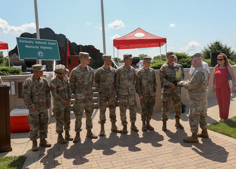 U.S. Army Maj. Gen. Haldane Lamberton, Kentucky's adjutant general, presents "The Cob" to the Kentucky National Guard Marathon Team at the Kentucky National Guard's 233rd birthday celebration in Frankfort, June 24, 2025.