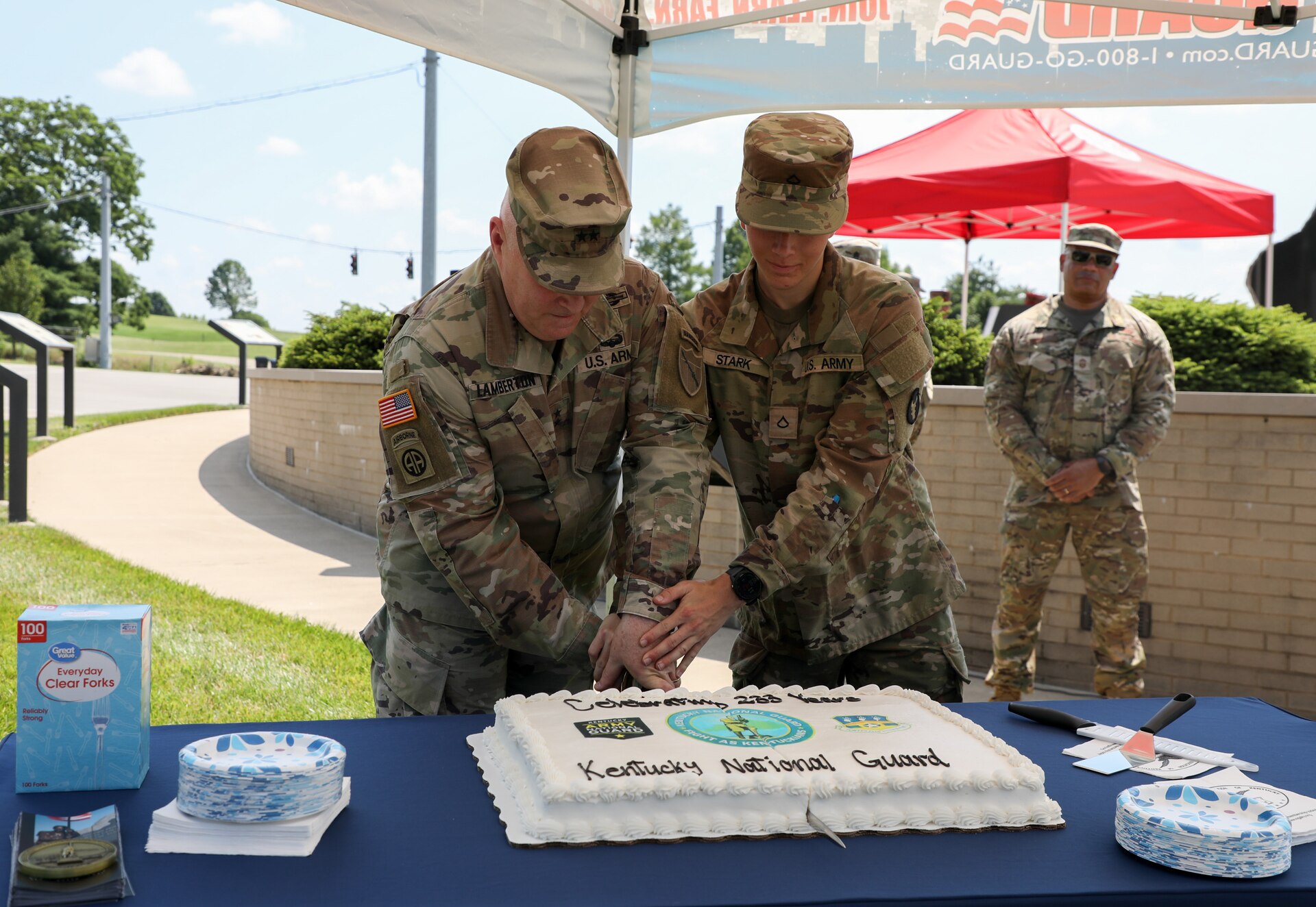 U.S. Army Maj. Gen. Haldane Lamberton and Pfc. Alexander Stark cut the cake together at the celebration of the 233rd birthday of the Kentucky National Guard in Frankfort, June 24, 2025.