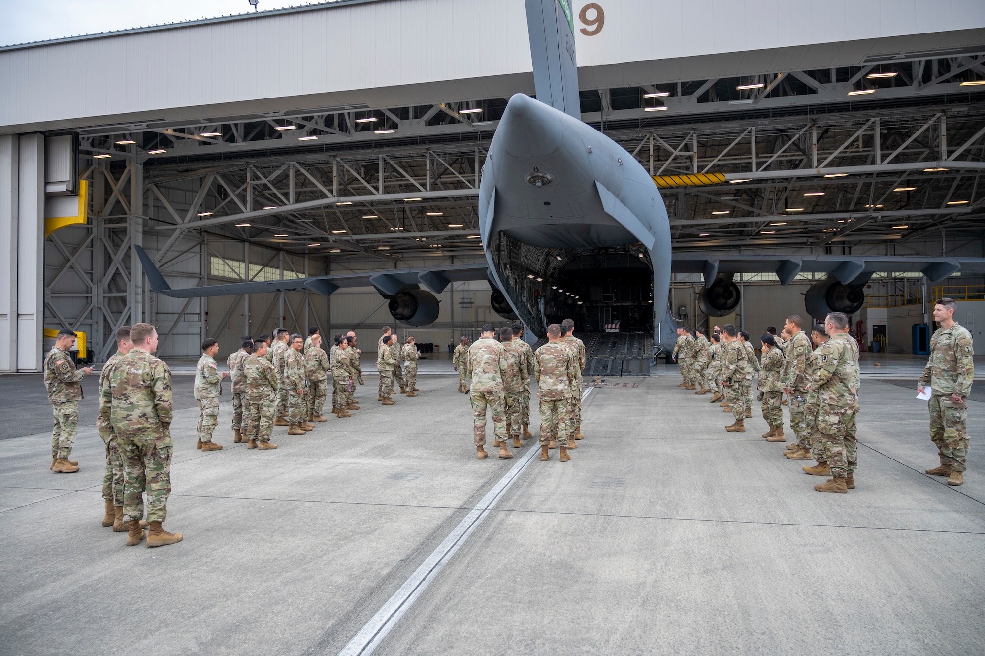 U.S. Airmen and Soldiers from Joint Base Lewis-McChord prepare for dignified transfer ramp ceremony training at Joint Base Lewis-McChord, Washington, July 10, 2025.