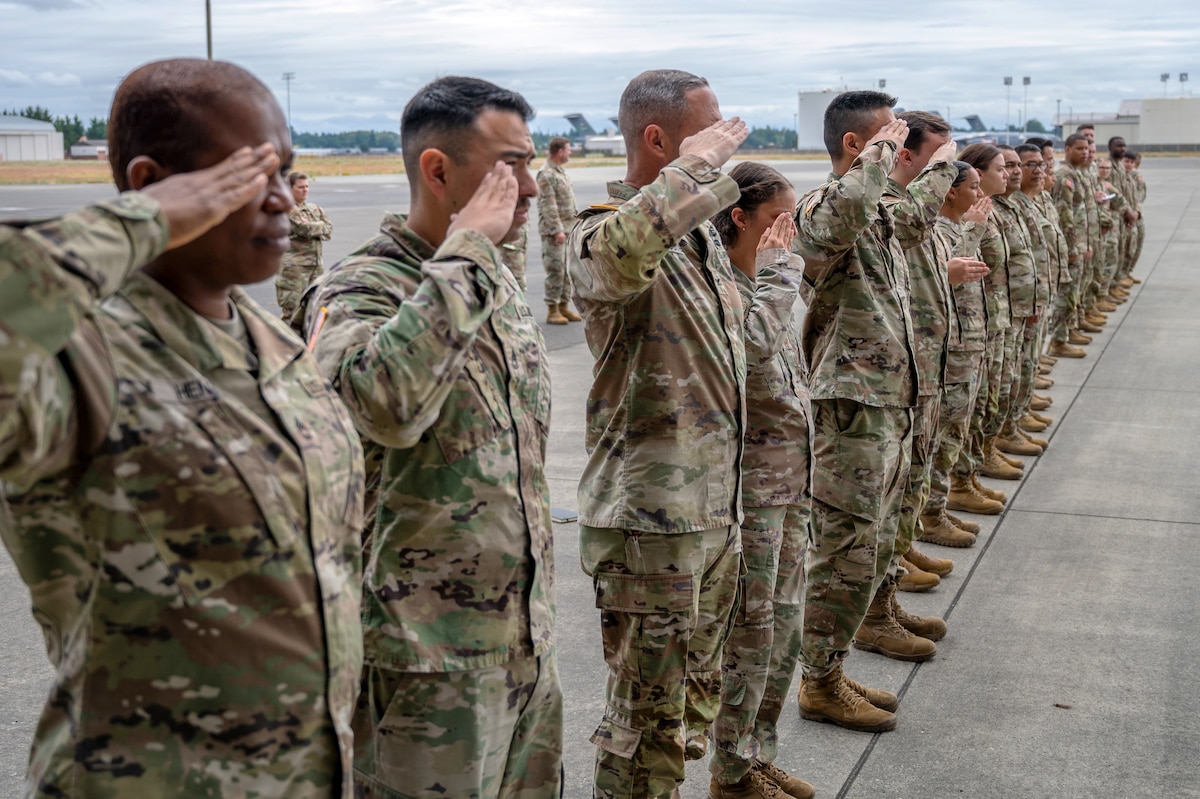 U.S. Airmen and Soldiers from Joint Base Lewis-McChord, salute during a dignified transfer ramp ceremony training at JBLM, Washington, July 10, 2025.