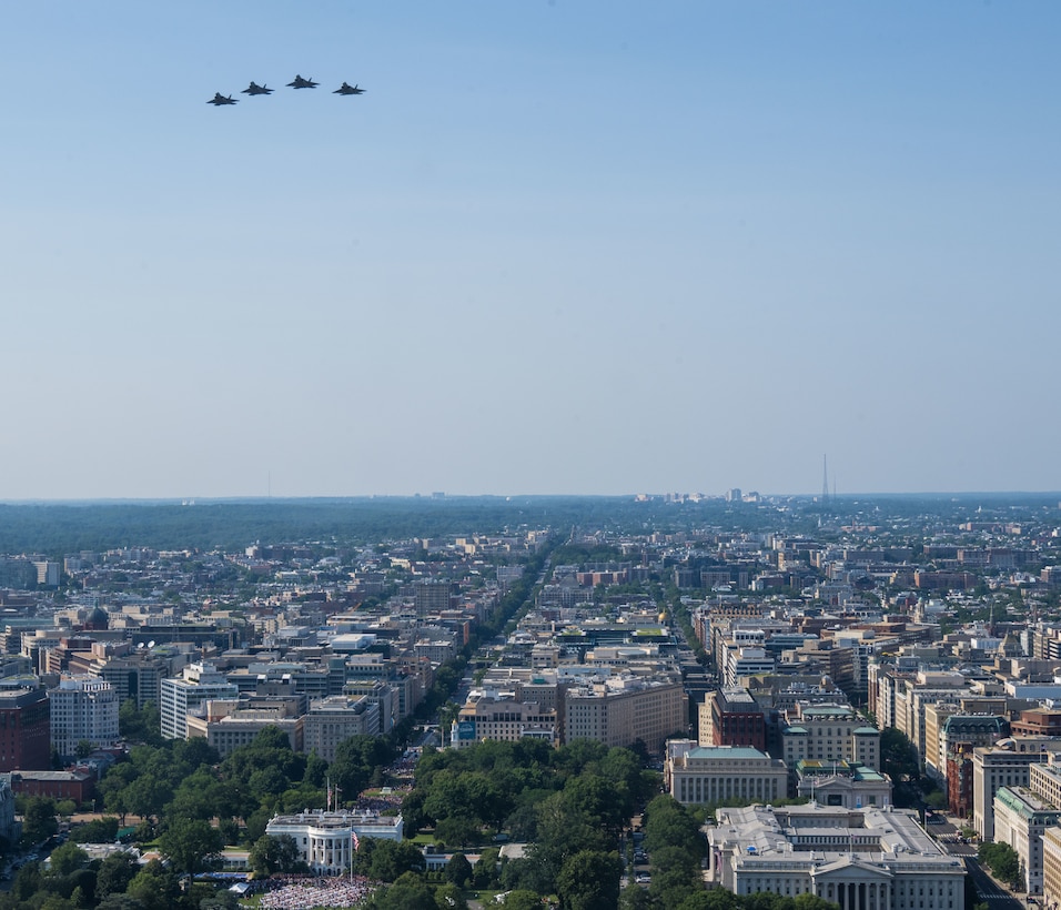 Four U.S. Air Force F-22 Raptors, conduct a flyover over the White House.