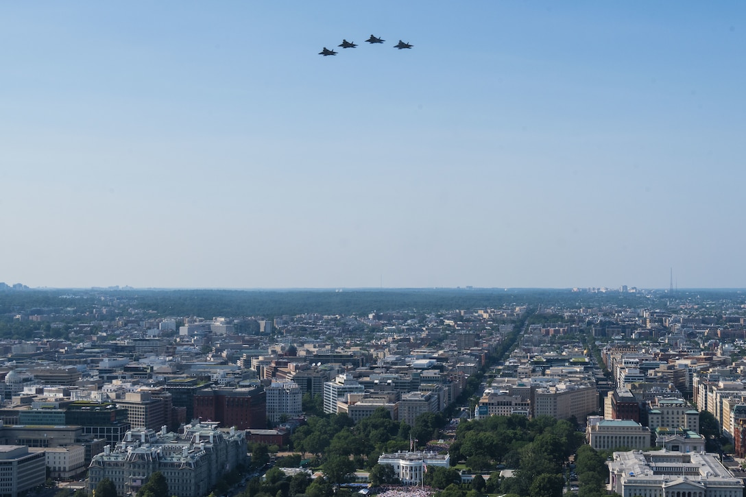 Four U.S. Air Force F-22 Raptors, conduct a flyover over the White House.