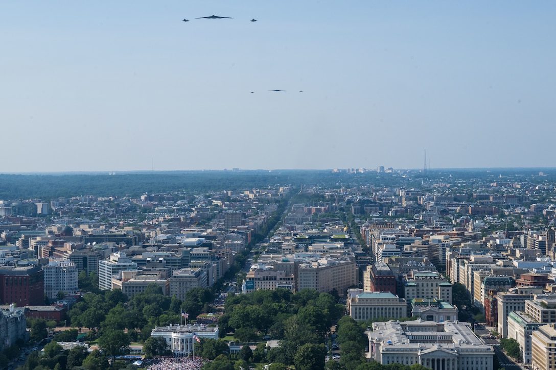 Two U.S. Air Force B-2 Spirits, accompanied by two F-35A Lightning IIs, and two F-22 Raptors flyover the White House.