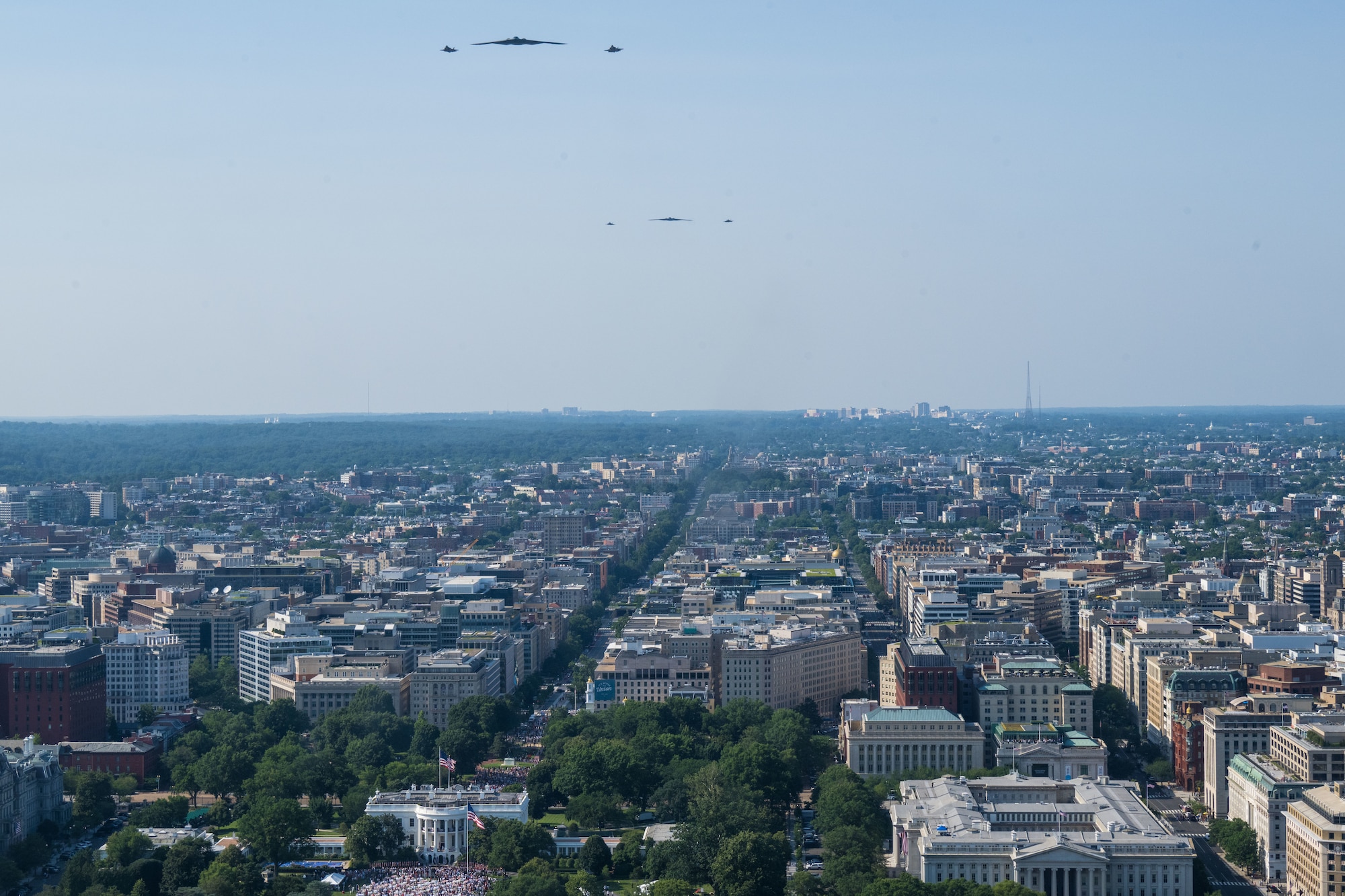 Two U.S. Air Force B-2 Spirits, accompanied by two F-35A Lightning IIs, and two F-22 Raptors flyover the White House.