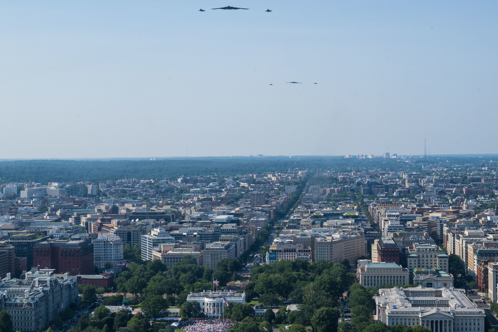 Two U.S. Air Force B-2 Spirits, accompanied by two F-35A Lightning IIs, and two F-22 Raptors, during a flyover over the White House.