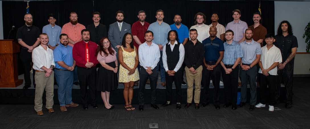 250711-N-DG679-1014
JACKSONVILLE, Fla. (July 11, 2025) The graduating class of the 2025 Fleet Readiness Center Southeast’s (FRCSE) Trades Apprenticeship Program. During the ceremony hosted at University of North Florida, FRCSE graduated 26 apprentices from the program. FRCSE’s apprenticeship program is a paid, four-year work study that provides benefits and the opportunity to learn a journeyman-level trade. (U.S. Navy Photo by Toiete Jackson)