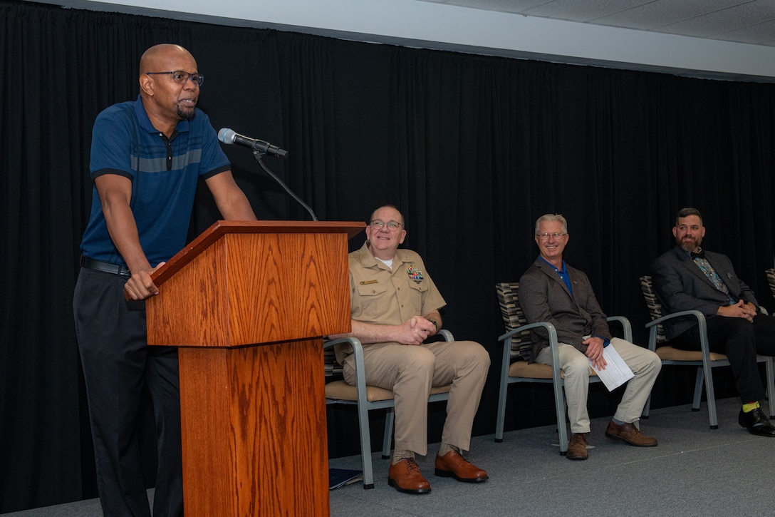 250711-N-DG679-1008
JACKSONVILLE, Fla. (July 11, 2025) Martin Henry, an electronics mechanic apprentice at Fleet Readiness Center Southeast’s (FRCSE), serves as the class speaker during FRCSE’s 2025 Trades Apprenticeship Program graduation ceremony held at University of North Florida. FRCSE’s apprenticeship program is a paid, four-year work study that provides benefits and the opportunity to learn a journeyman-level trade. (U.S. Navy Photo by Toiete Jackson)
