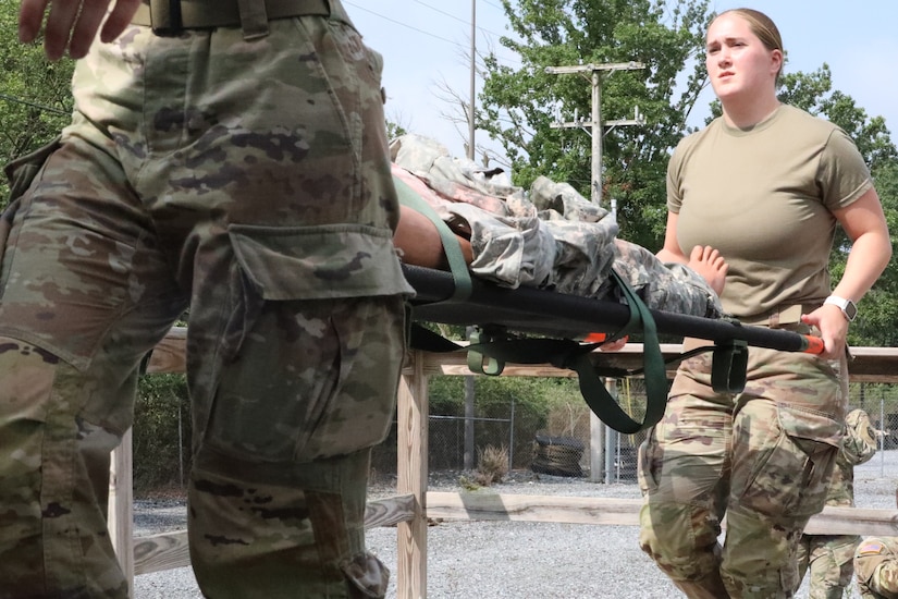 U.S. Soldiers with the 108th Medical Company Area Support, 213th Readiness Support Group, Pennsylvania Army National Guard, establish a medical facility and provide aid to combat casualties during the unit’s field medical exercise at Fort Indiantown Gap, Pennsylvania, July 16, 2025. The exercise simulated medical treatment, medical care and skills necessary to perform mission essential tasks in an austere environment. (U.S. Army National Guard photo by Spc. Annie M. Riley.)