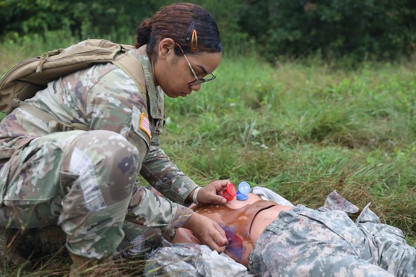 U.S. Soldiers with the 108th Medical Company Area Support, 213th Readiness Support Group, Pennsylvania Army National Guard, establish a medical facility and provide aid to combat casualties during the unit’s field medical exercise at Fort Indiantown Gap, Pennsylvania, July 16, 2025. The exercise simulates medical treatment, medical care and skills necessary to perform mission essential tasks in an austere environment. (U.S. Army National Guard photo by Spc. Annie M. Riley.)